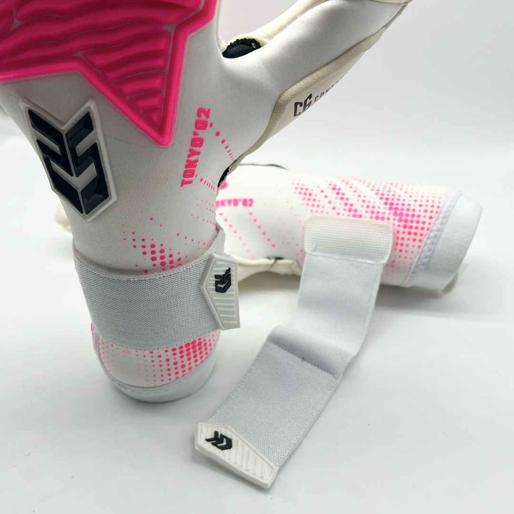 Guantes de Arquero Seoul '02 Pink Contacgrip goalkeeper gloves with pink accents and wrist straps on white background